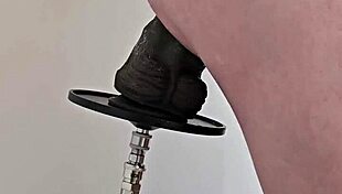 monster black dildo fucks ass from the side on machine