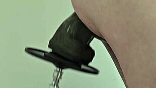 monster black dildo fucks ass from the side on machine