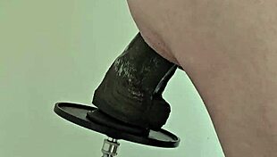 monster black dildo fucks ass from the side on machine