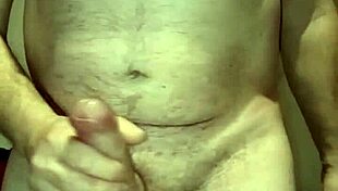 Bound handjob causes massive erection.