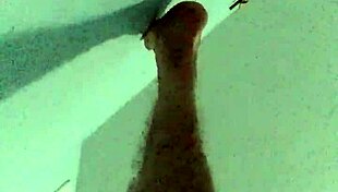 A guy, gay man, pleasures himself via anal masturbation with a cucumber