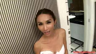 Tiny ladyboy Nok uses buttplug for solo masturbation