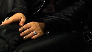 This rock chick struts in leather pants and a biker jacket.