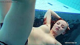 Redheaded Katrin STRIPS UNDERWATER in Sultry Pool Tease