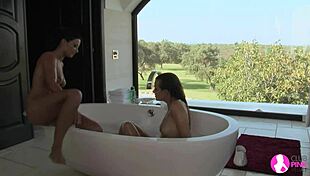 Brunette lesbians lick and finger in bath