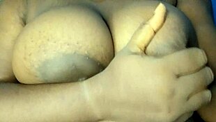 Ebony Woman Touches Her Busty Breasts