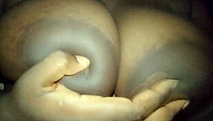 Ebony Woman Touches Her Busty Breasts