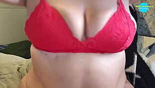 lonely housewife oils up her big tits and wanks them