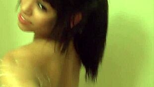 Hot busty latina with tattoos enjoys wet solo shower