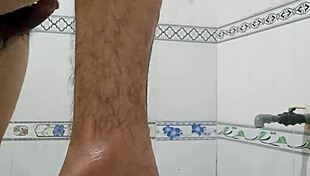 A teen bathes alone in the bathroom.