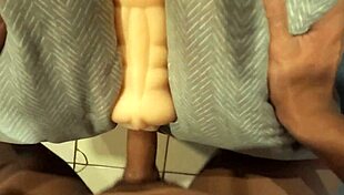 playing with a rubber vagina in a suggestive way