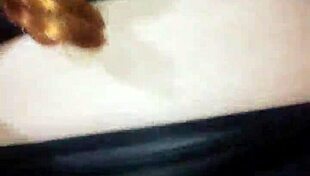 Face mask covers mouth as black dildo penetrates hardcore