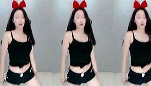 Pretty Chinese girl dances sexy on cam.