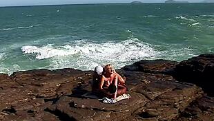 anal on the rocks with busty blonde tourist getting ass fucked by locals in interracial outdoor threesome