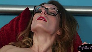 Glasses babe smears fresh cumshot all over her face after wild play.