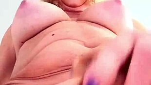 Does this mature blonde tease her big tits at work?