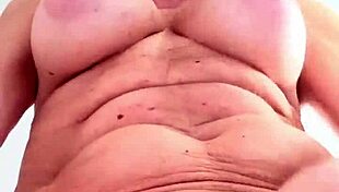 Does this mature blonde tease her big tits at work?