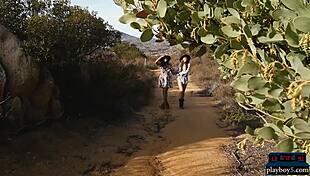 two brunette lesbians undress outdoors, playing with small tits