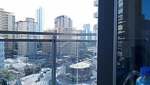 Hot gamer girl flashes big tits on balcony outdoors