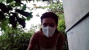 A solo masturbation scene in a public place