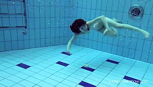 Roxalana Cheh Sexy Redhead Underwater.