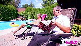 Tattooed Petite Brunette Enjoys Outdoor Pool Activity. Family Fun Ensues.