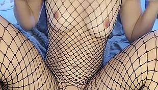 Intense fishnet vibrator orgasm closeup