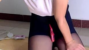 sexy mature woman uses vibrator on wet pussy while watching porn alone.