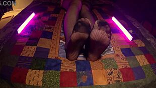 Perfect feet peek through fishnet pantyhose