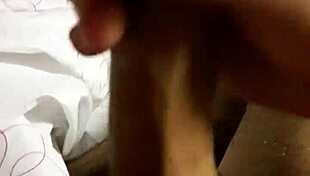 the amateur guy masturbates his big cock in front of the camera