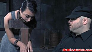 restrained submissive is whipped by male dominant in bondage session with toys and anal play