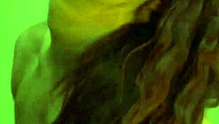 Busty Ginger Flexes Her Big Muscles in Front of the Mirror