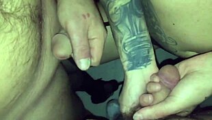TATTOED CHICK SUCKS STRANGER IN VIDEO BOOTH