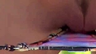 Randy moore lounges outdoors in a bikini, playfully teasing her tits in solo fun.