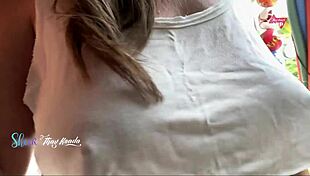 Hot wife flashes big natural tits to seller while shopping outdoors.