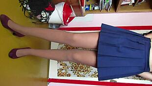 Leg fetish model teases in skirt and stockings for custom video