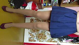 Leg fetish model teases in skirt and stockings for custom video