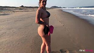 Blonde girl fucked doggystyle on beach.