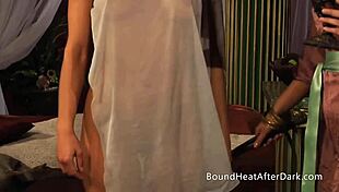 The mistress casually undresses her two submissive lesbian slaves, binding them and giving light whips on their big tits.