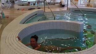 Hungarian babe flashes tits and masturbates at the spa desk!