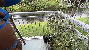 Lucy Hayz waters plants in bedroom