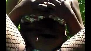 Masked girl masturbates outdoor