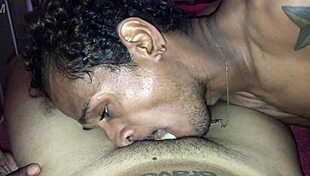 In a hotel room, a black guy with a 22cm cock gives a passionate blowjob