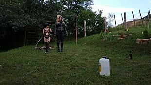 Beth Kinky, sexy goth domina, trains her shemale slave in public bdsm session part 2