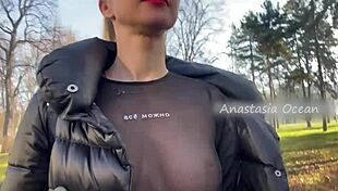 Beautiful blonde flashes natural big tits in public park