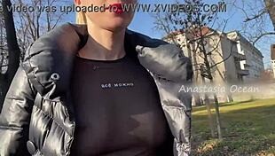 Beautiful blonde flashes natural big tits in public park