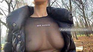 Beautiful blonde flashes natural big tits in public park
