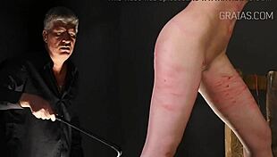 Tiny redhead feels intense pain as she's whipped in the garage