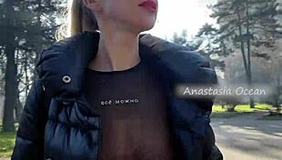 Beautiful blonde flashes natural big tits in public park