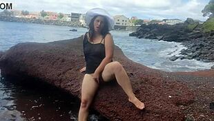 The seductive stepmom lures on a public beach